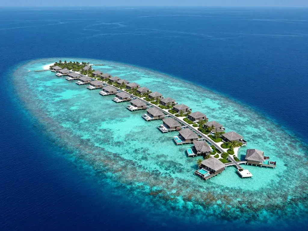 7 Elite Luxury Travel Destinations 3 Aerial view of a private island resort in the Maldives
